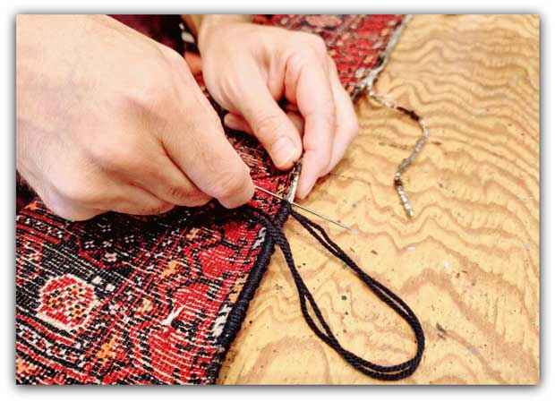 riparazione artigianale bordo tappeti a mano milano